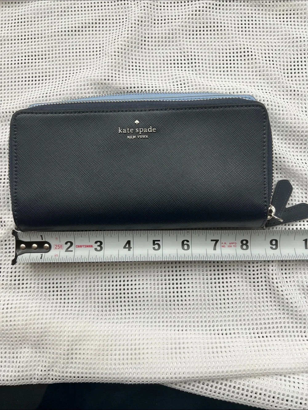 kate spade navy zip-around leather wallet with blue trim